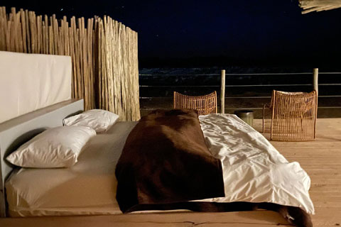 Rooftop bedroom under the namib desert sky at Little Kulala Camp Sossuvlei Namibia