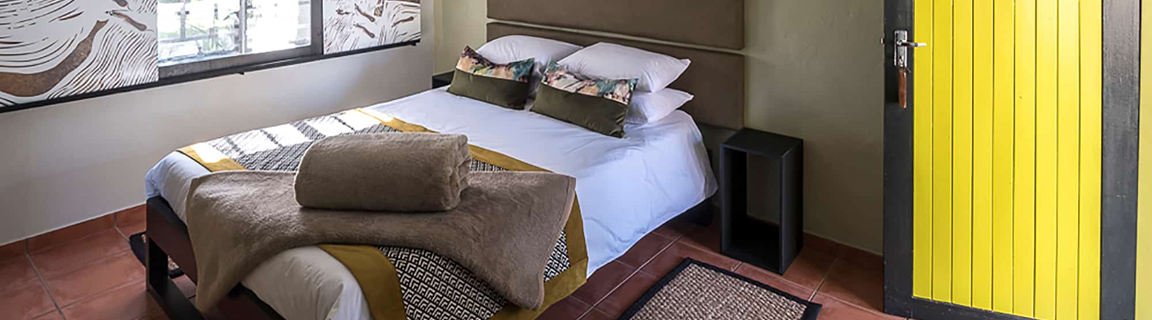 Namib Desert Lodge guest rooms spread along the base of fossilised red namib sand dunes near Sossusvlei Namibia